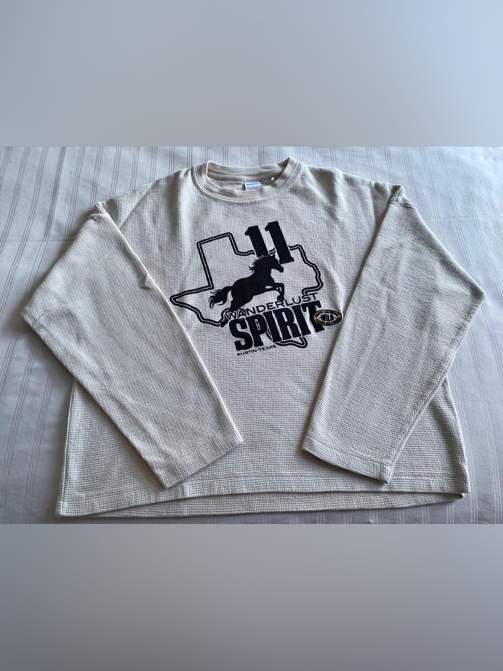 Bershka Cream Waffle Knit Long Sleeve Top with Black Graphic